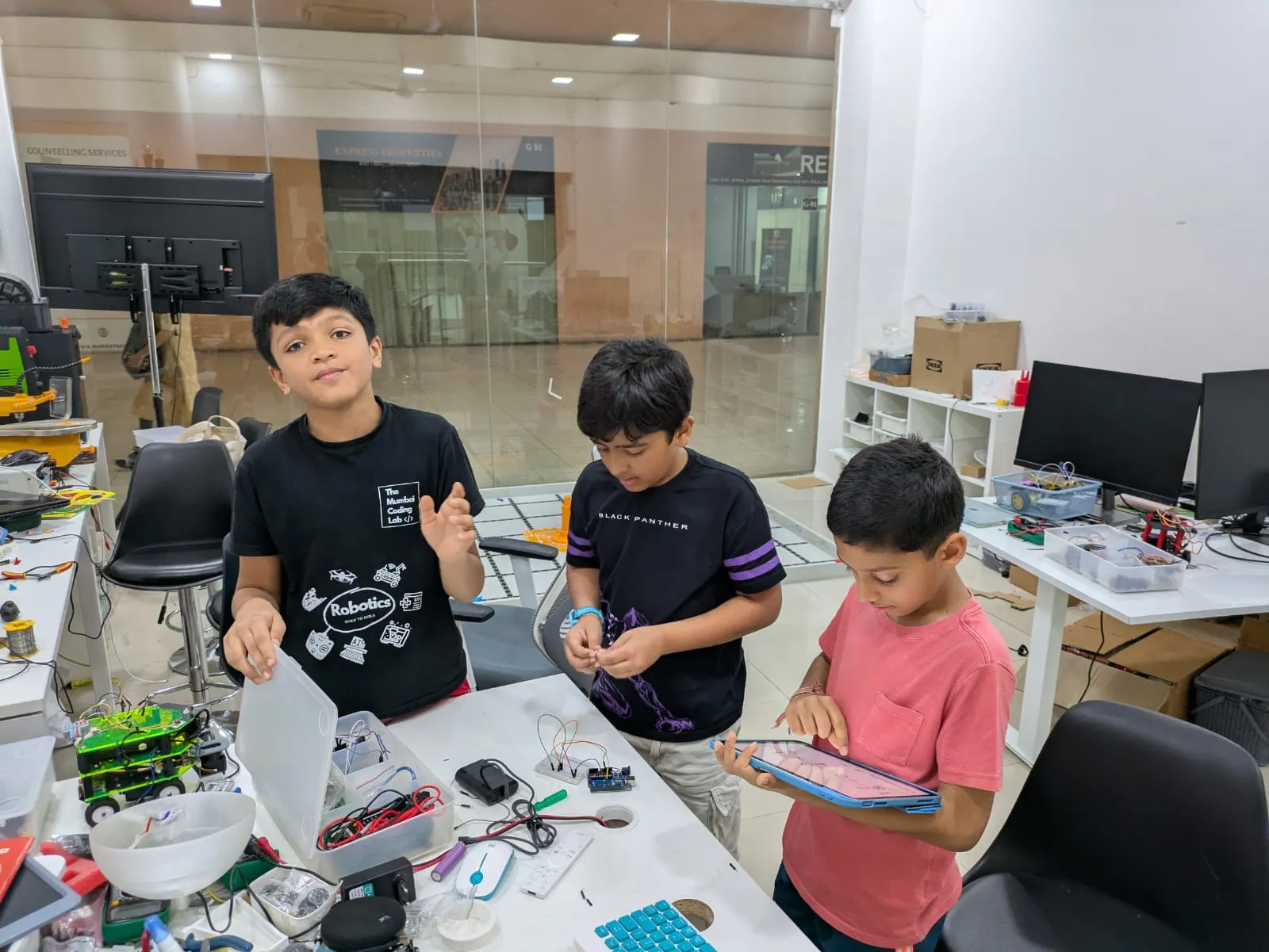 Group of students learning robotics